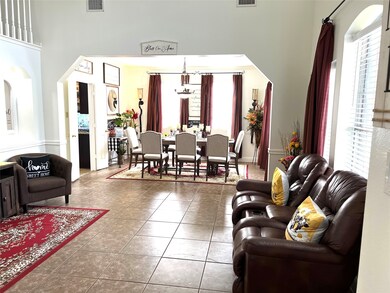 Greet your guests in this large formal living room adjoined to the formal dining room just beyond. French doors lead to the kitchen.
