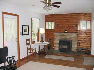Gorgeous wood floors and wood burning fireplace in