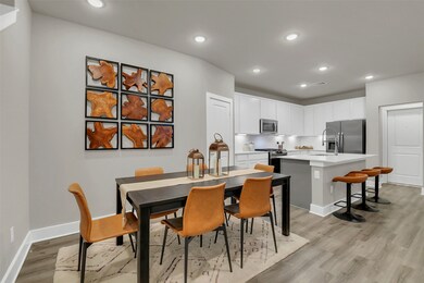 Great dining area connected to kitchen. Opens into