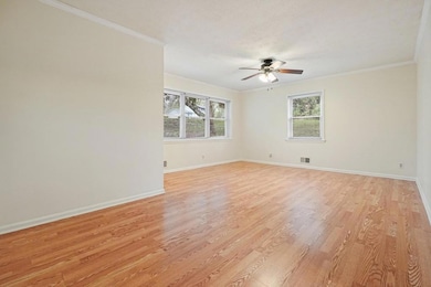 The large living room is freshly painted.