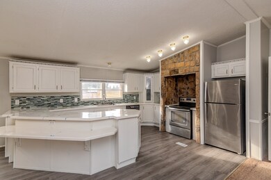 Large kitchen - lots of counter space. The refrigerator, stove, and dishwasher remain.