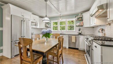 Spacious kitchen renovated with new cabinetry, cou
