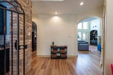 Spacious entry area with a wine grotto behind the gate.