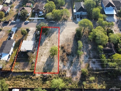 Aerial view of residential area with property parcel outlined