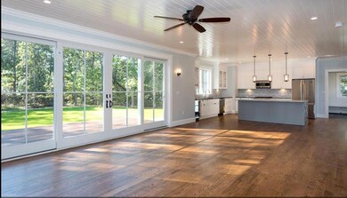 Photo of a similar home showing sliding glass doors open to the deck