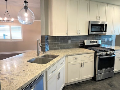 Renovated kitchen with stainless steel appliances,