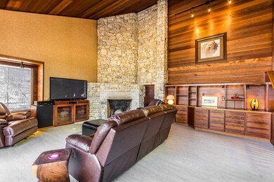 What a focal point! This floor to ceiling stone, w