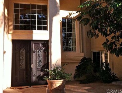 Newly refinished double front door entryway in the