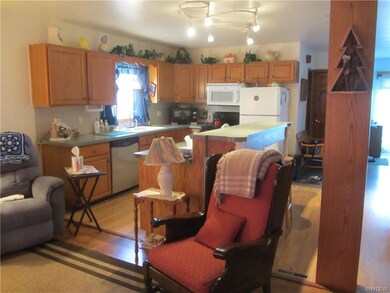Lower: Open concept from living room to kitchen wi