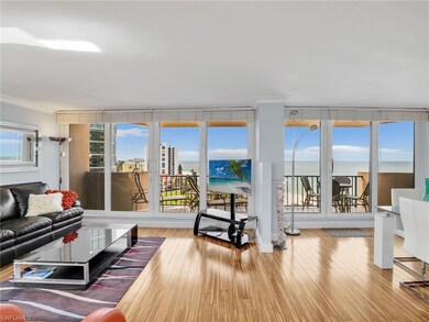 Living area with crown molding and hardwood / wood-style flooring