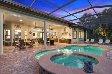 Exterior View of Salt Water Swimming Pool with Screened Lanai, Outdoor Dining and Entertaining, and Heated Saltwater Pool and Spa
