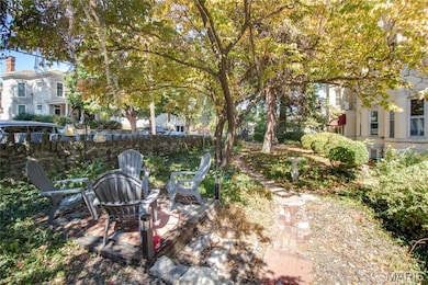 View of yard with an outdoor fire pit