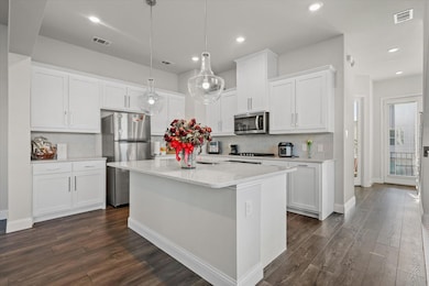Kitchen with appliances with stainless steel finis
