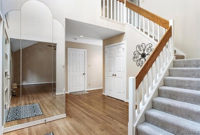 Stairs with light hardwood flooring