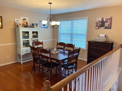 Formal dining room with gorgeous hardwoods and located off the kitchen.