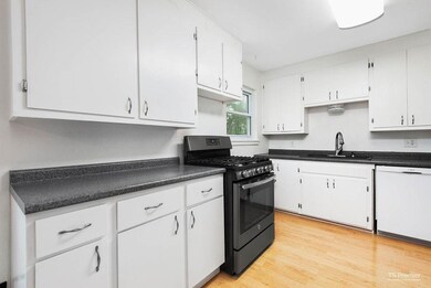 Light and bright kitchen features plenty of countertop and storage space.