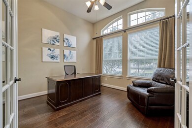 There is a large study with a wall of windows, wid