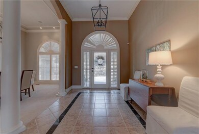 Formal entry looks out to waterfall...