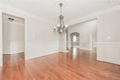 Dining Room features trim ceiling molding, picture