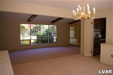 The lovely dining room features custom built-ins a