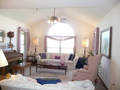 Living Room. Vaulted ceiling with architectural window.