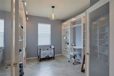 Or home office with french doors, light tile patte