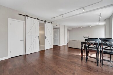 Dining space featuring dark wood-type flooring, a 