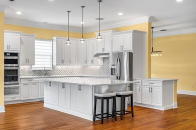 Heavily upgraded kitchen; yellow walls show curren