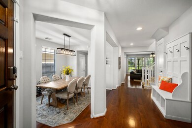 Office with French doors is positioned to the right, with a formal dining room to the left.