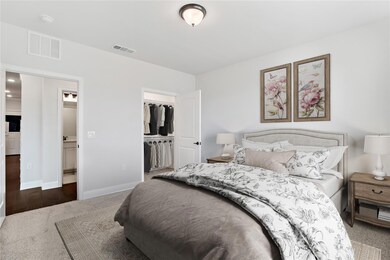 The secondary bedroom has a large closet and tons 