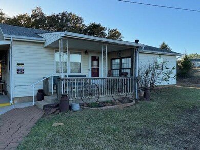 Single story home featuring covered porch and a fr