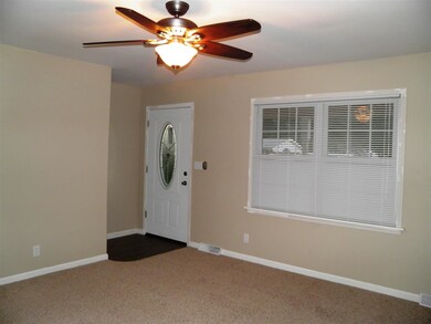 Pretty entry into the living room with a coat clos
