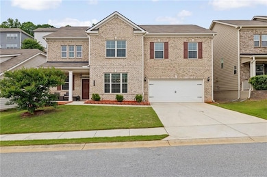 Craftsman house with brick siding, concrete drivew