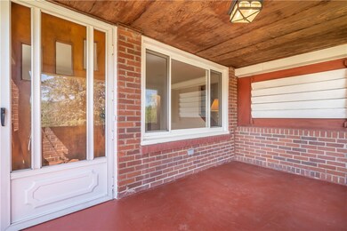 Private covered front porch is great for relaxing
