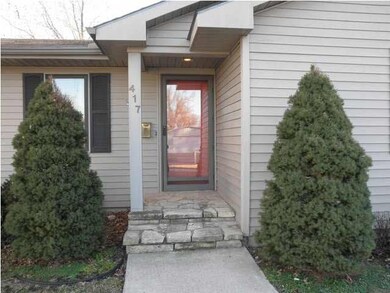 Front porch nicely landscaped front yard has sprin