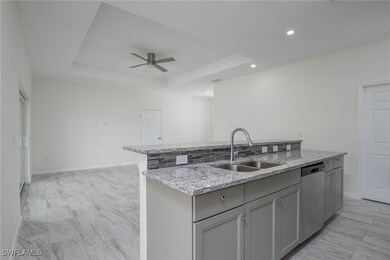 Kitchen with dishwasher, a kitchen island with sin