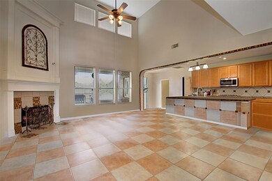 VIRTUAL FURNITURE REMOVAL. A peak of the living room and kitchen with the furniture removed.
