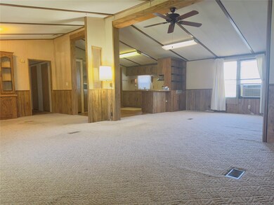 Carpeted spare room with cooling unit, vaulted cei