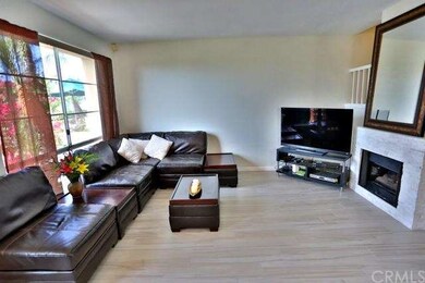 Wood Tile flooring through out, cozy fireplace