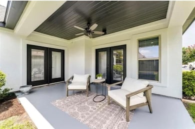 View of patio / terrace with ceiling fan and french doors