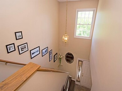View of entry from 2nd floor landing shows the hig
