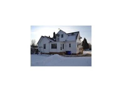 Exterior Back. Rear entrance to the house has a sm