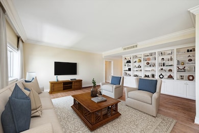 Living Room with Built-in Wall Unit and Window Tre