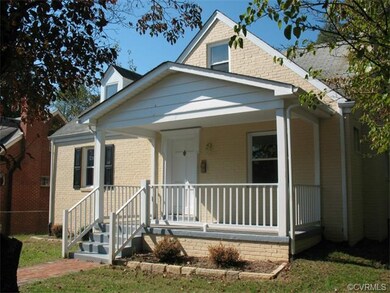 Covered front porch. Freshly painted brick.