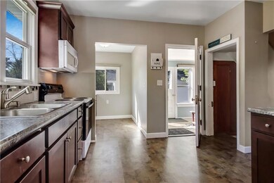 Kitchen and butlers pantry opens to back porch, di