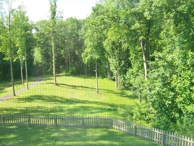 View of Partial Fenced in Front Yard