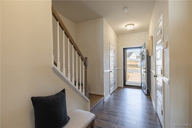 Entry hallway show stairs to the second floor as w