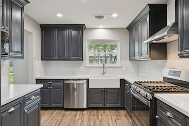 Step into a renovated kitchen offering Quartz countertops complemented by a coordinating backsplash and tons of cabinet storage. Perfect for cooking!