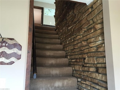 Beautiful natural stone on stairway to second floo