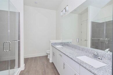 Primary bathroom with walk-in shower, walk-in clos